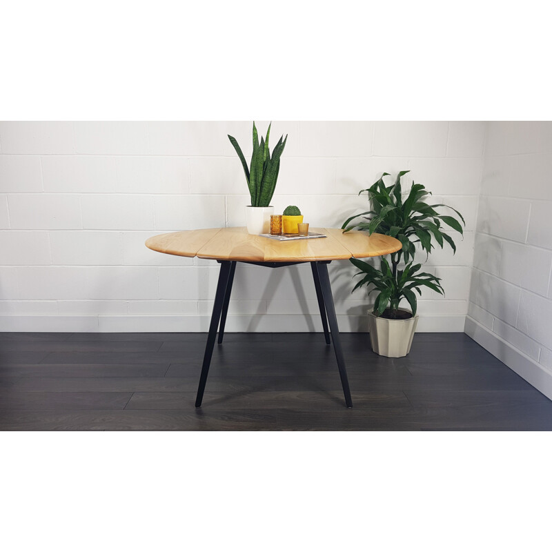 Vintage Ercol black leg round drop leaf dining table, 1960s