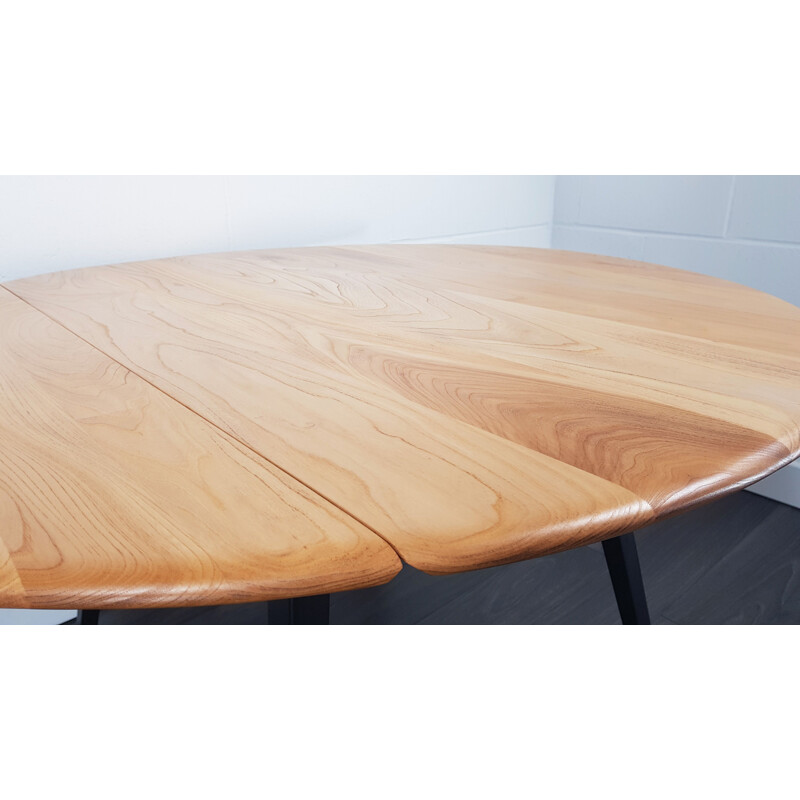 Vintage Ercol black leg round drop leaf dining table, 1960s