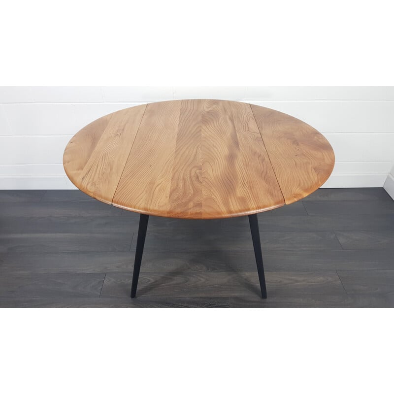 Vintage Ercol black leg round drop leaf dining table, 1960s