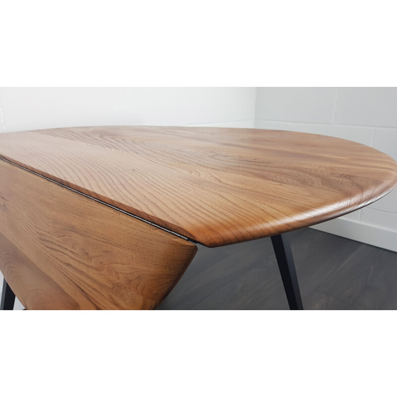 Vintage Ercol black leg round drop leaf dining table, 1960s