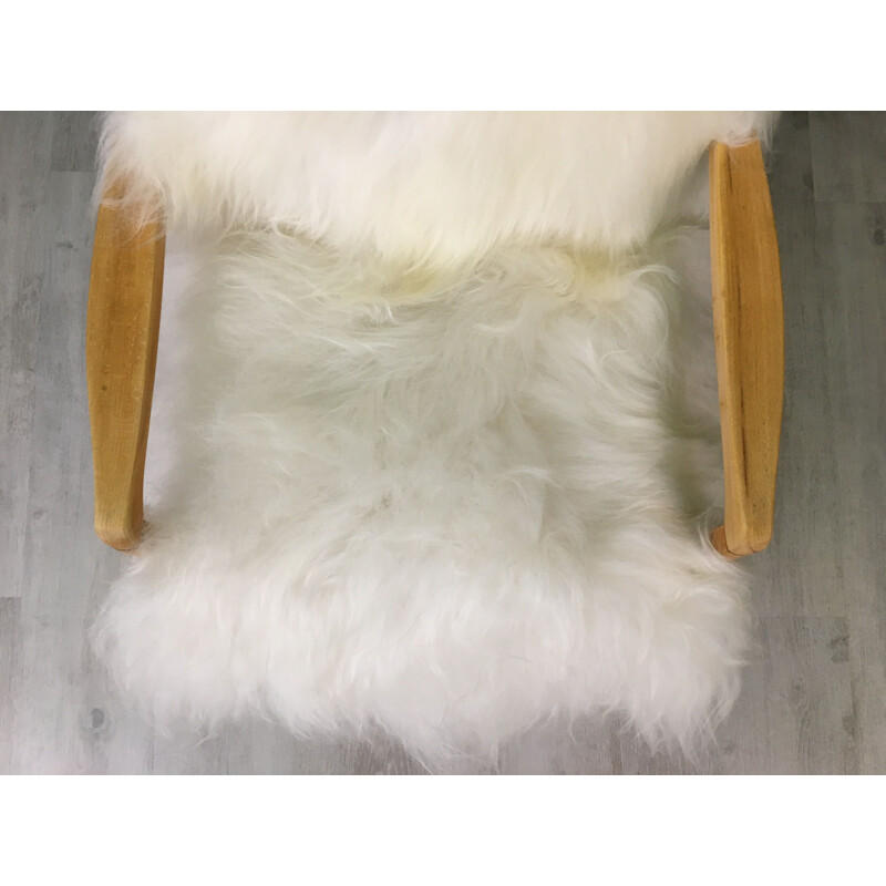 Fauteuil vintage en peau de mouton blanc