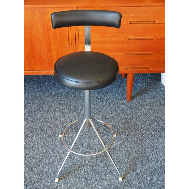 Vintage industrial factory stool in padded black vinyl