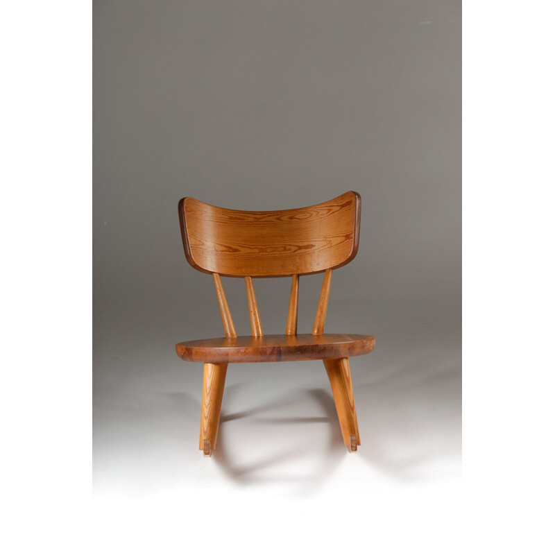 Swedish rocking chair in pinewood and sheepskin - 1940s