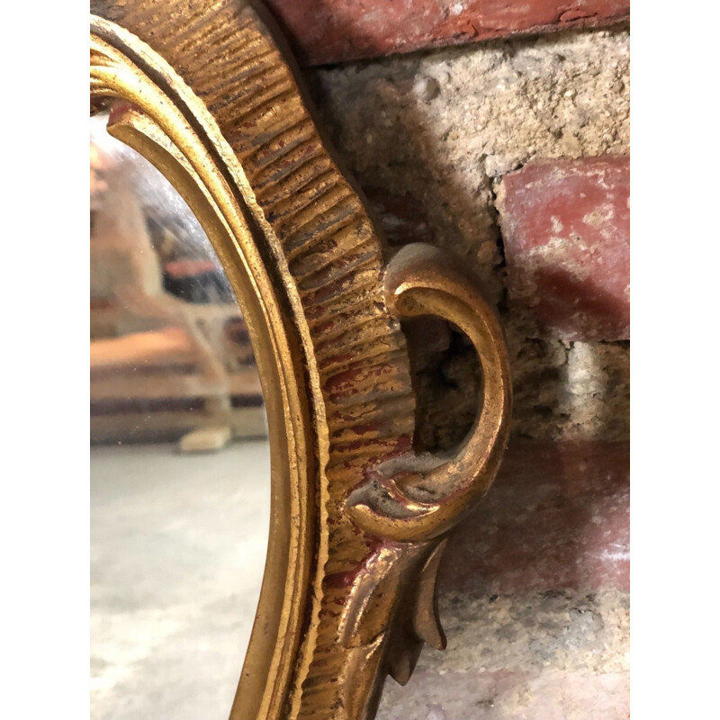 Miroir oval italien vintage style Louis XV en bois doré 1970