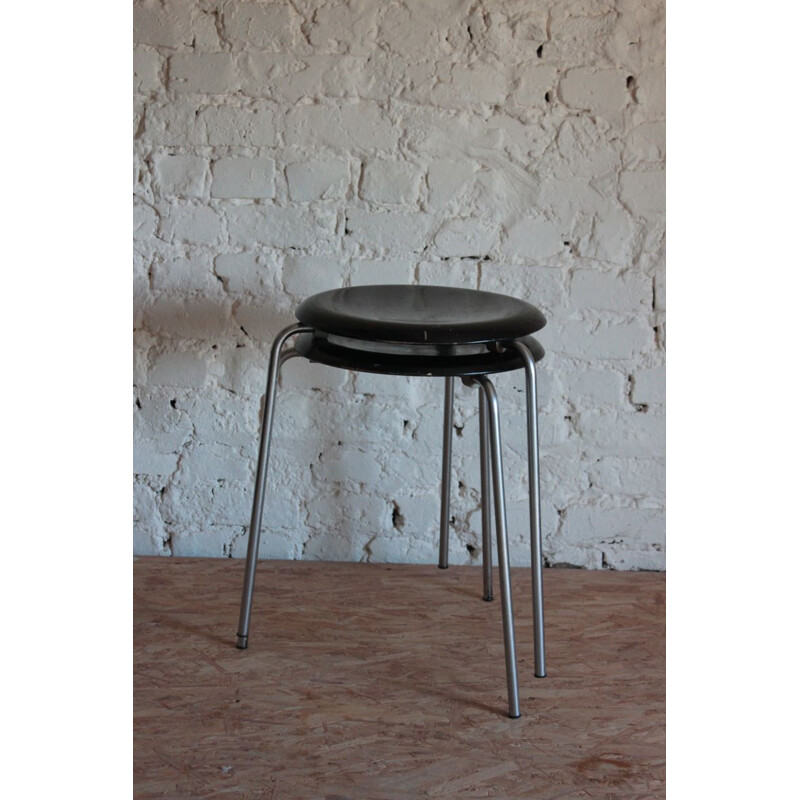 Pair of vintage tripod stools with chrome base and black seat by Jocobsen for Fritz Hansen