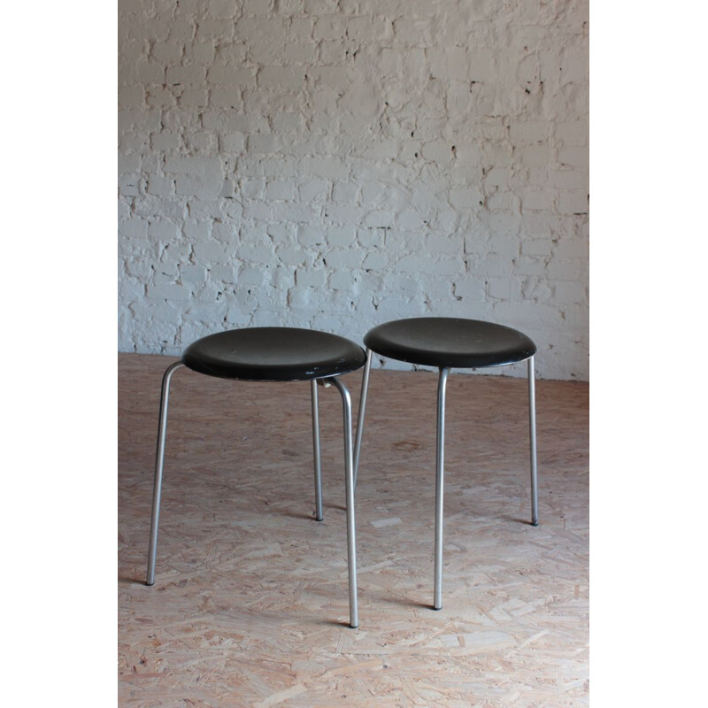 Pair of vintage tripod stools with chrome base and black seat by Jocobsen for Fritz Hansen