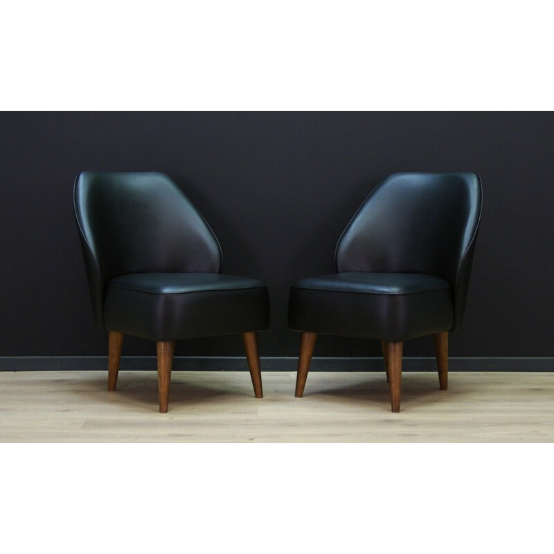 Vintage wooden armchair in black leather