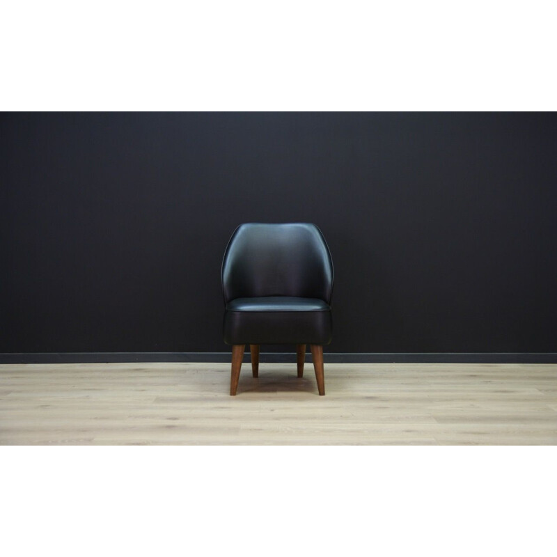 Vintage wooden armchair in black leather