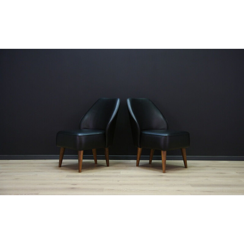 Vintage wooden armchair in black leather