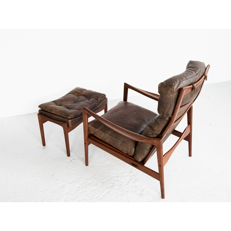 Vintage  easy chair and ottoman in teak and leather by Ib Kofod Larsen