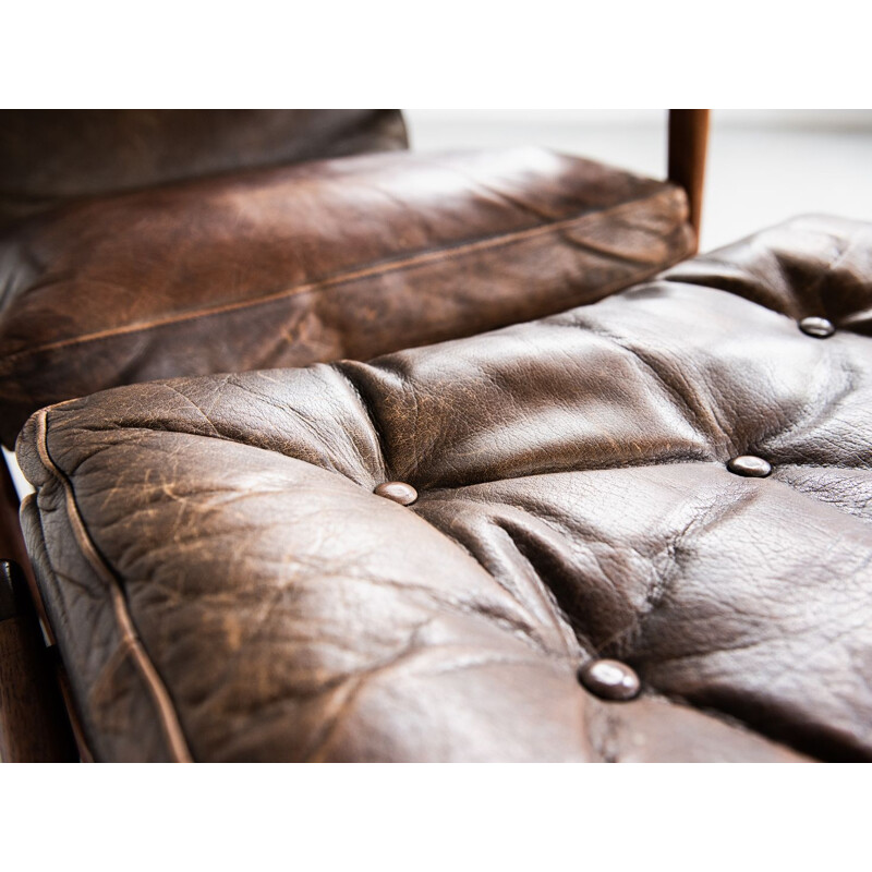 Vintage  easy chair and ottoman in teak and leather by Ib Kofod Larsen