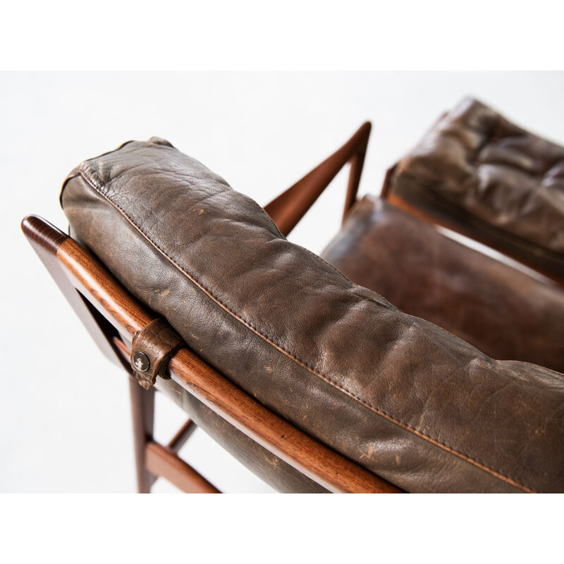 Vintage  easy chair and ottoman in teak and leather by Ib Kofod Larsen