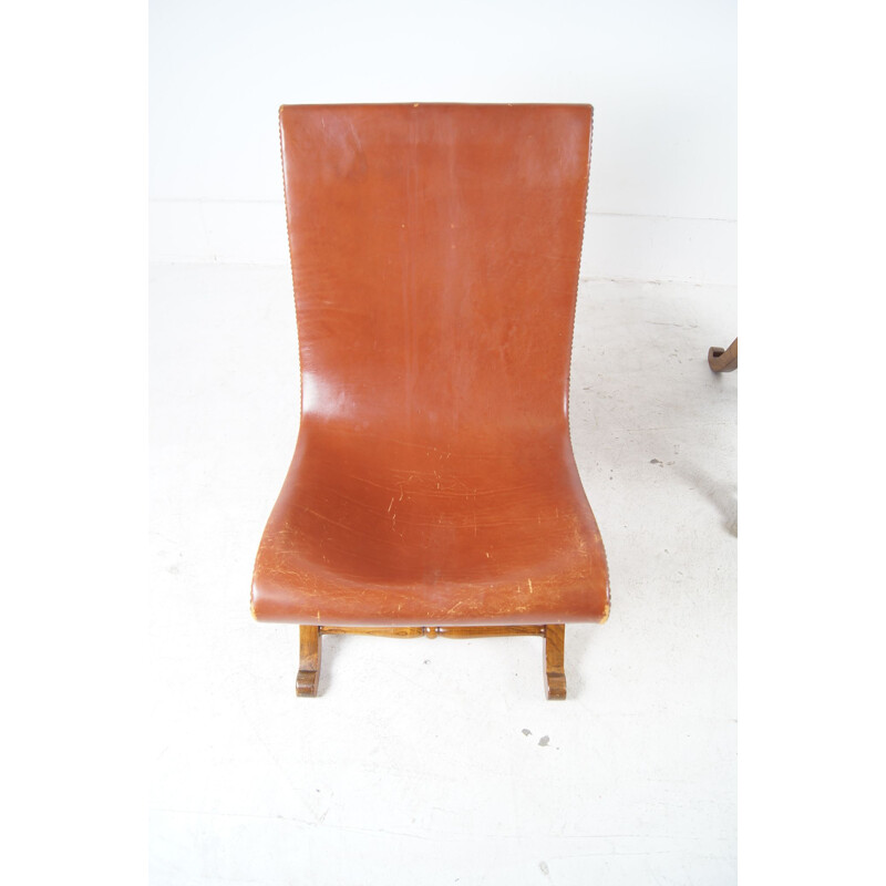 Paire de fauteuils bas vintage en cuir cogac 