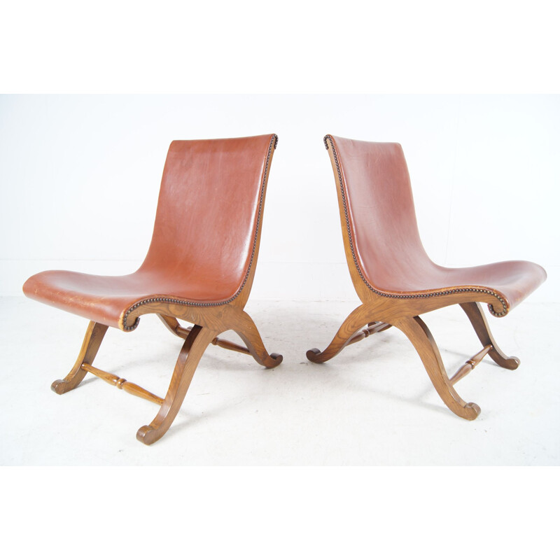 Vintage pair of low easychairs in cogac leather 