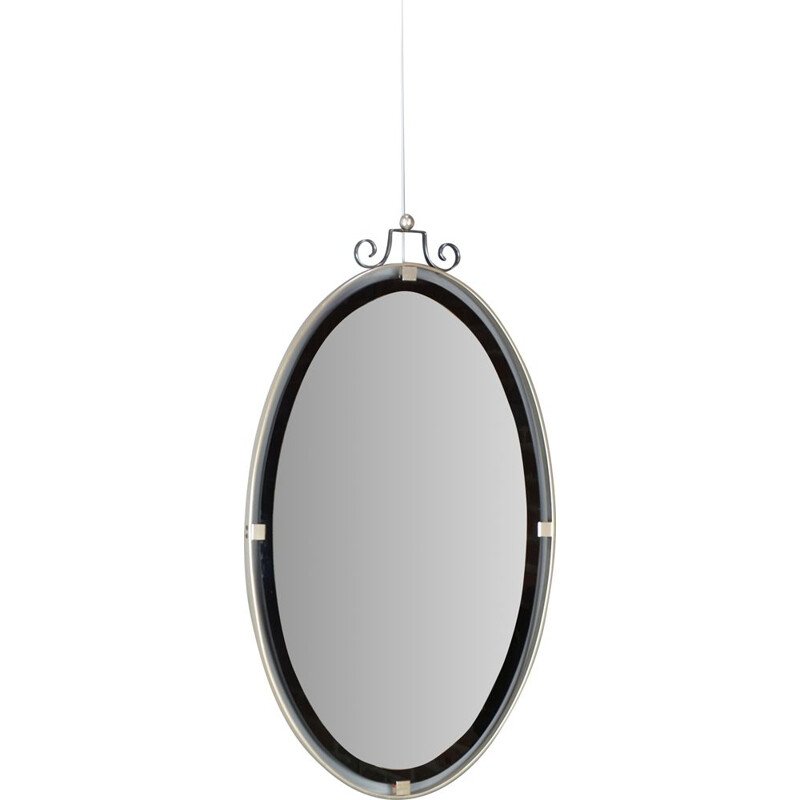 Vintage oval mirror suspended in chrome