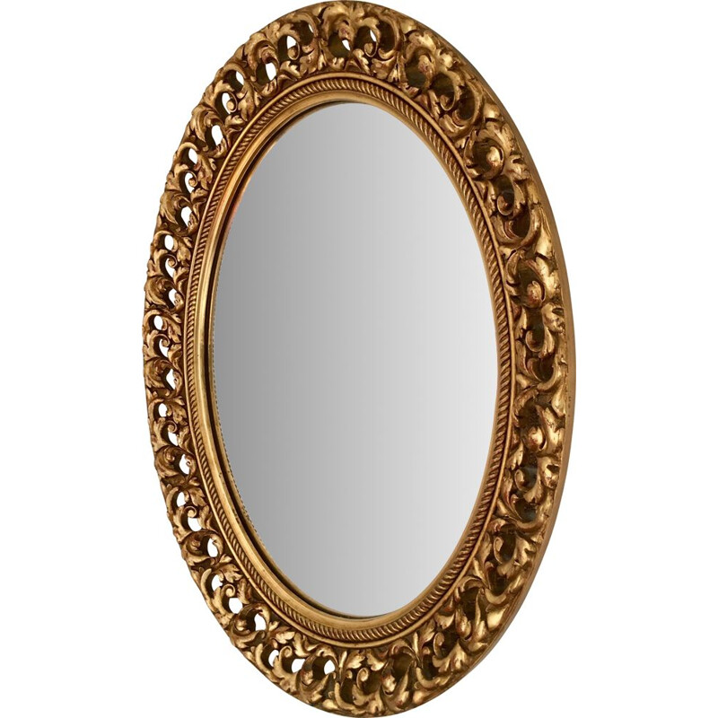 Vintage oval mirror in gilded wood