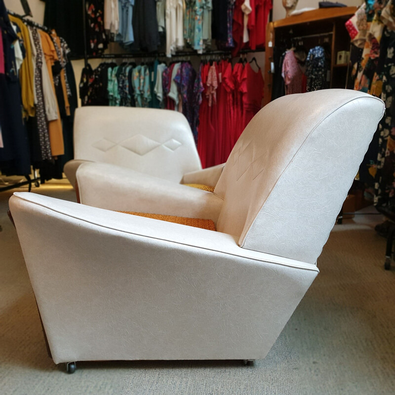 Pair of Vintage cream vinyl armchairs, Britain