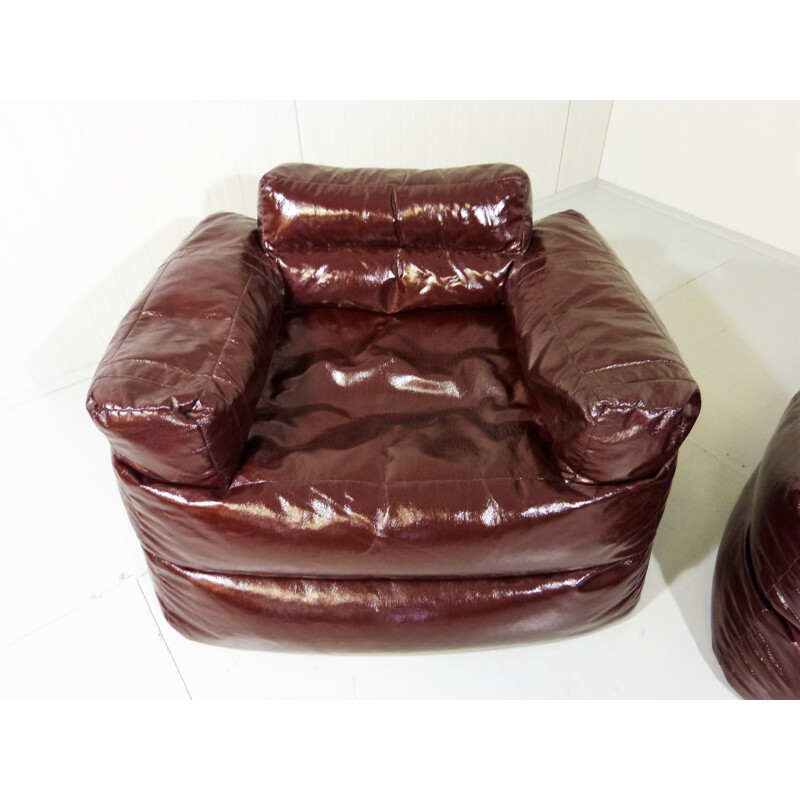 Pair of Italian armchairs and a footrest in darkbrown synthetic fabric - 1980s