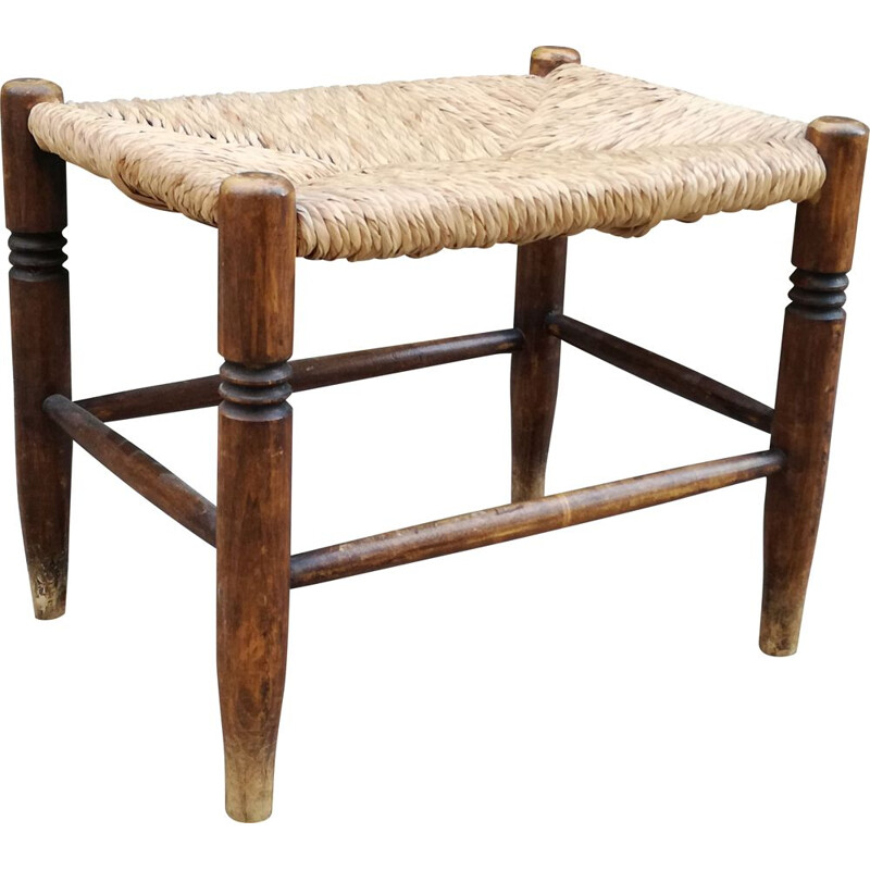 Vintage stool made of wood and woven straw