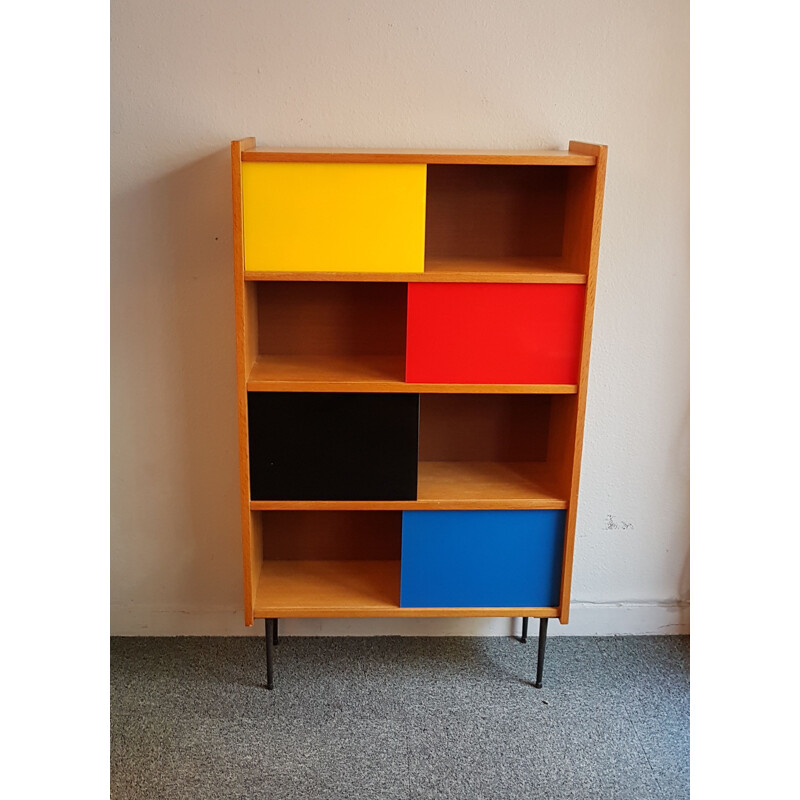 Bookcase with colored sliding windows from the 60's