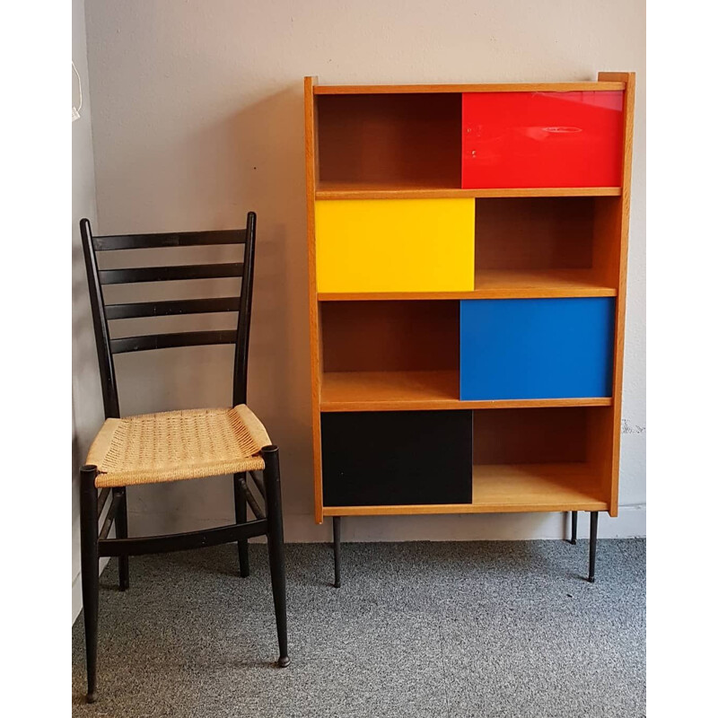 Bookcase with colored sliding windows from the 60's