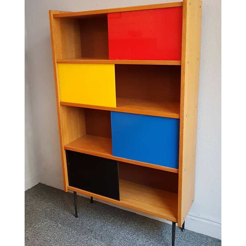 Bookcase with colored sliding windows from the 60's