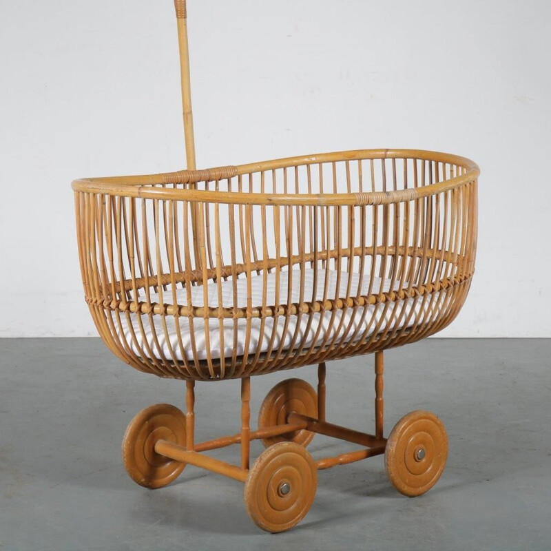 Vintage Rattan baby bed manufactured in the Netherlands 1950