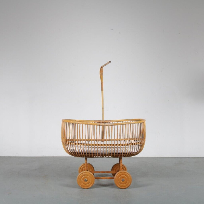 Vintage Rattan baby bed manufactured in the Netherlands 1950