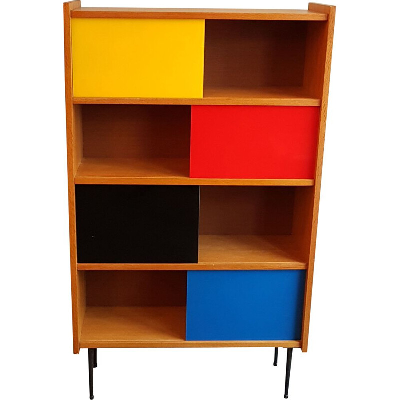 Bookcase with colored sliding windows from the 60's