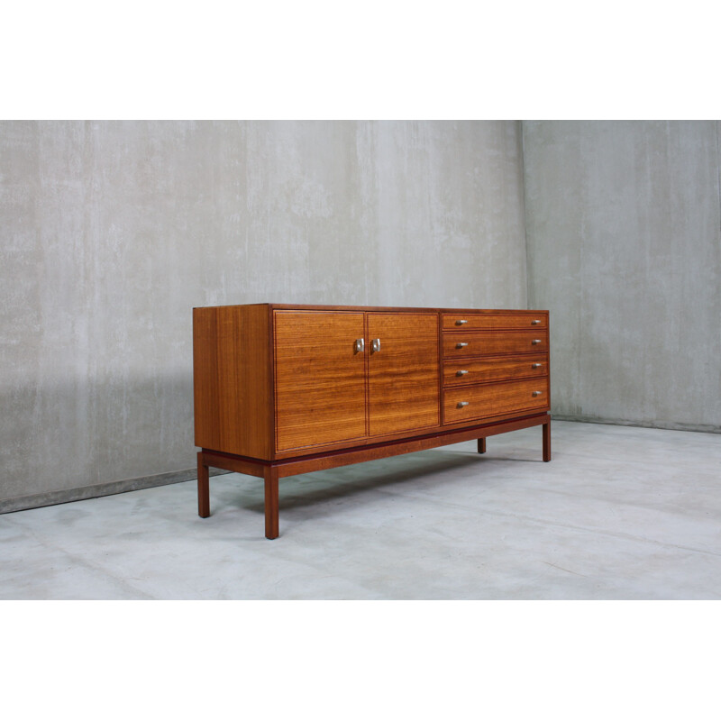  Vintage English sideboard, made from teak and features 1960s