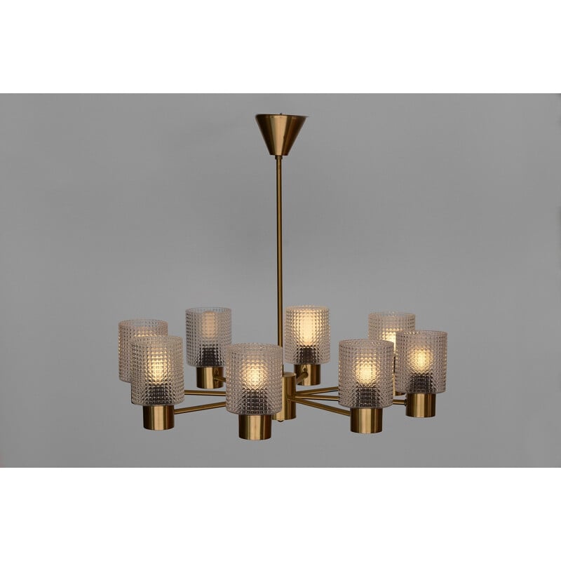 Brass eight arm chandelier with glass shades by HJA. Sweden 1960s