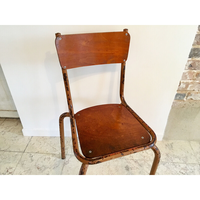 Vintage school chair in mustard color