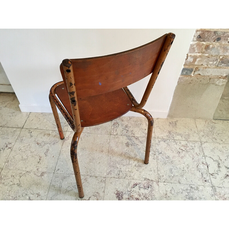 Vintage school chair in mustard color