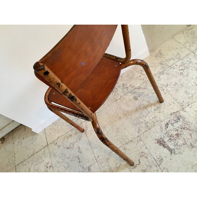 Vintage school chair in mustard color