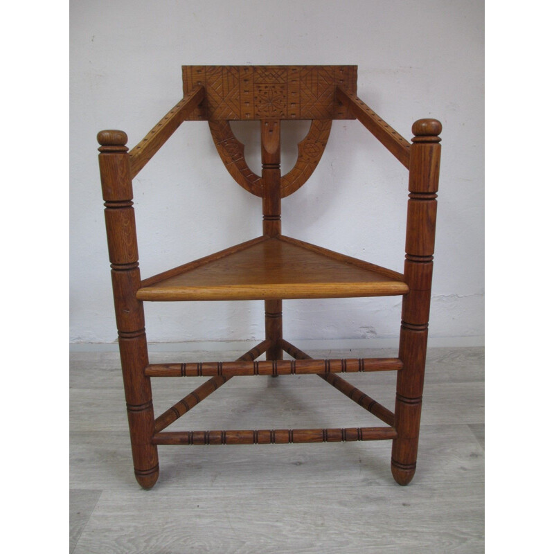 Vintage oak chair with triangular seat and rich carving, 1960