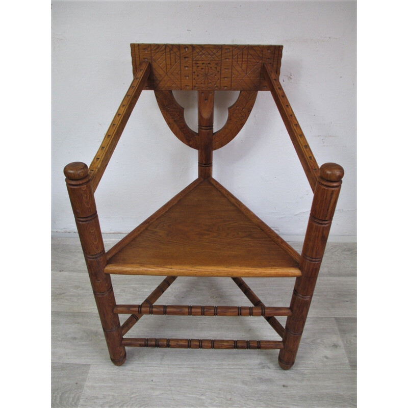 Vintage oak chair with triangular seat and rich carving, 1960