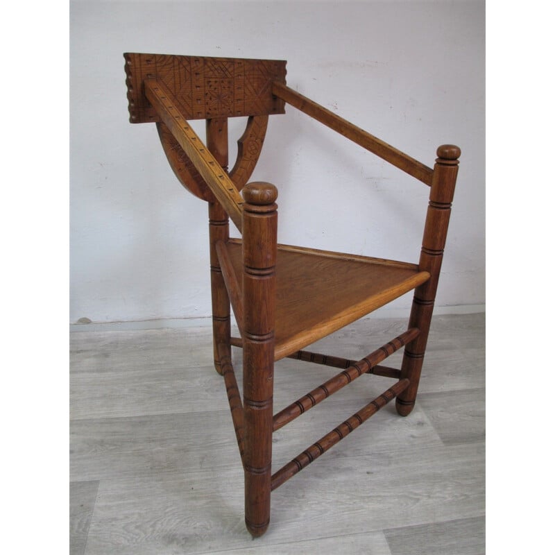 Vintage oak chair with triangular seat and rich carving, 1960