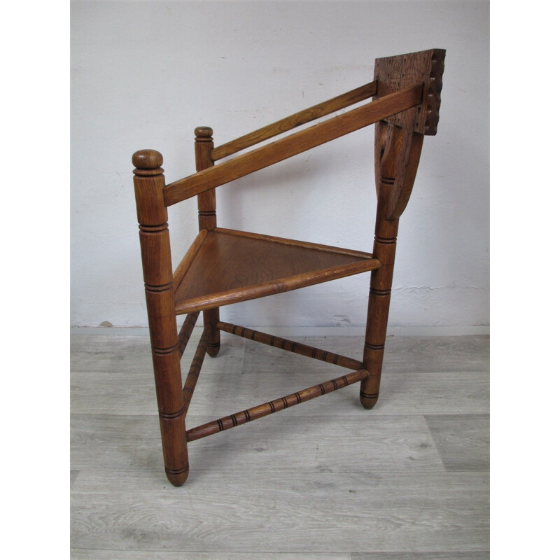 Vintage oak chair with triangular seat and rich carving, 1960