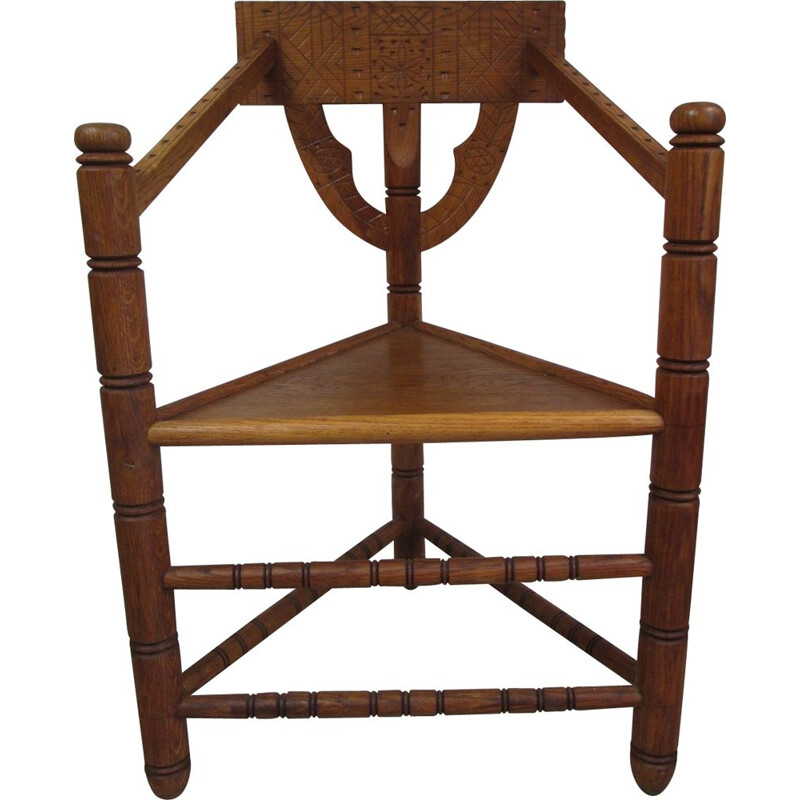 Vintage oak chair with triangular seat and rich carving, 1960