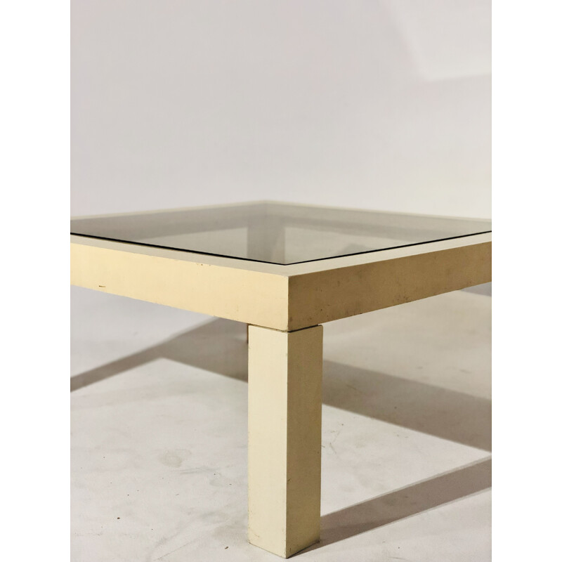 White plastic coffee table with glass top