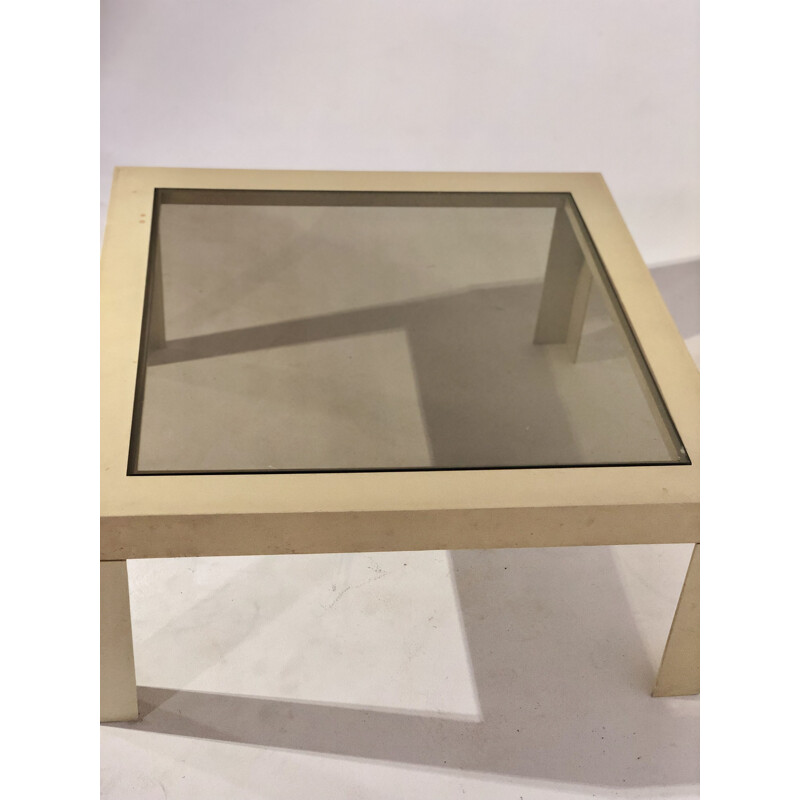 White plastic coffee table with glass top