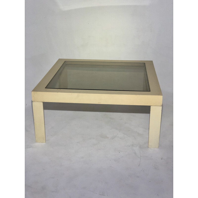 White plastic coffee table with glass top