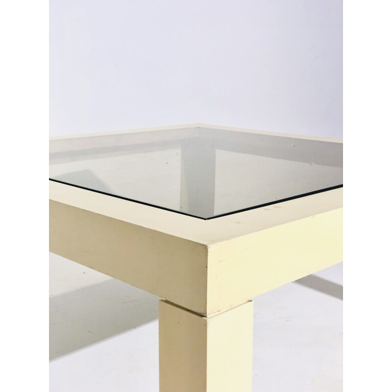 White plastic coffee table with glass top