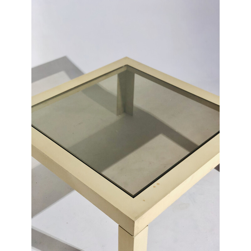 White plastic coffee table with glass top