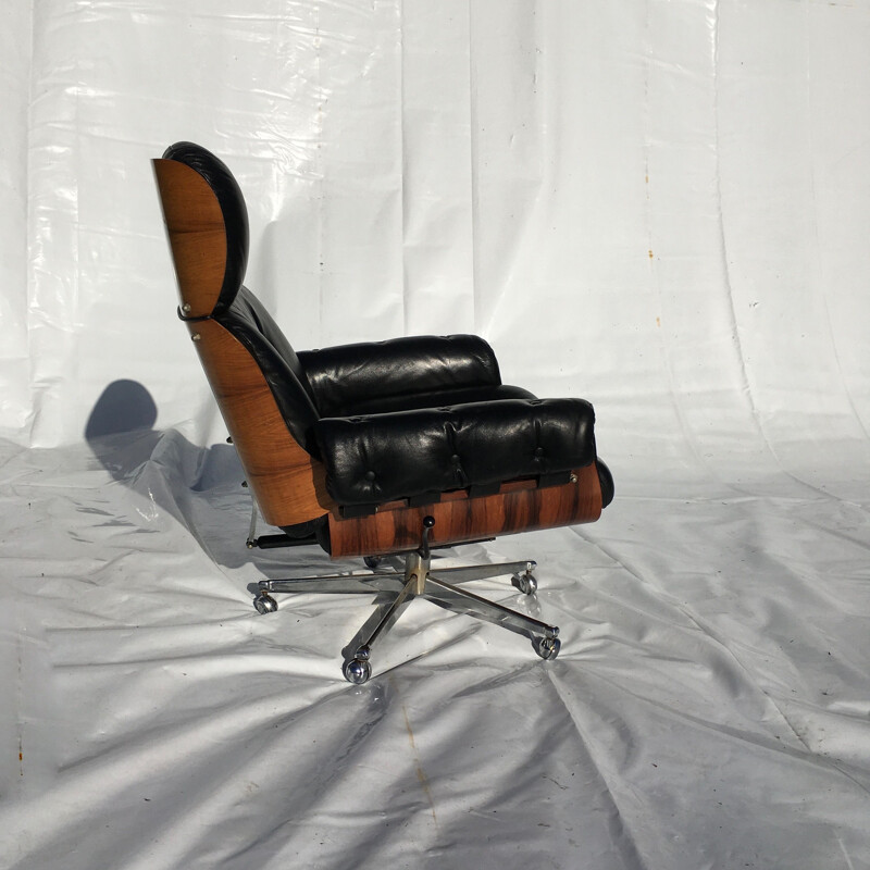 Vintage leather and rosewood armchair and ottoman 1960