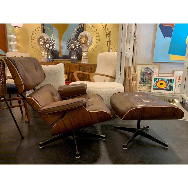 Brown leather lounge chair and Ottoman by Charles and Ray Eames