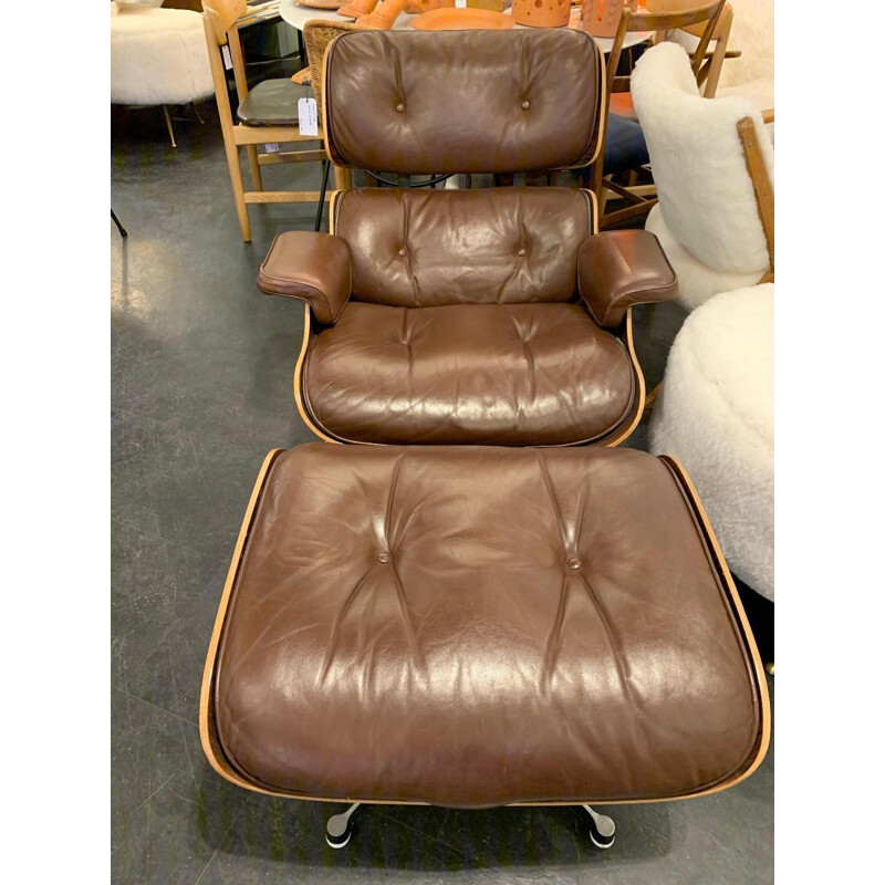 Brown leather lounge chair and Ottoman by Charles and Ray Eames