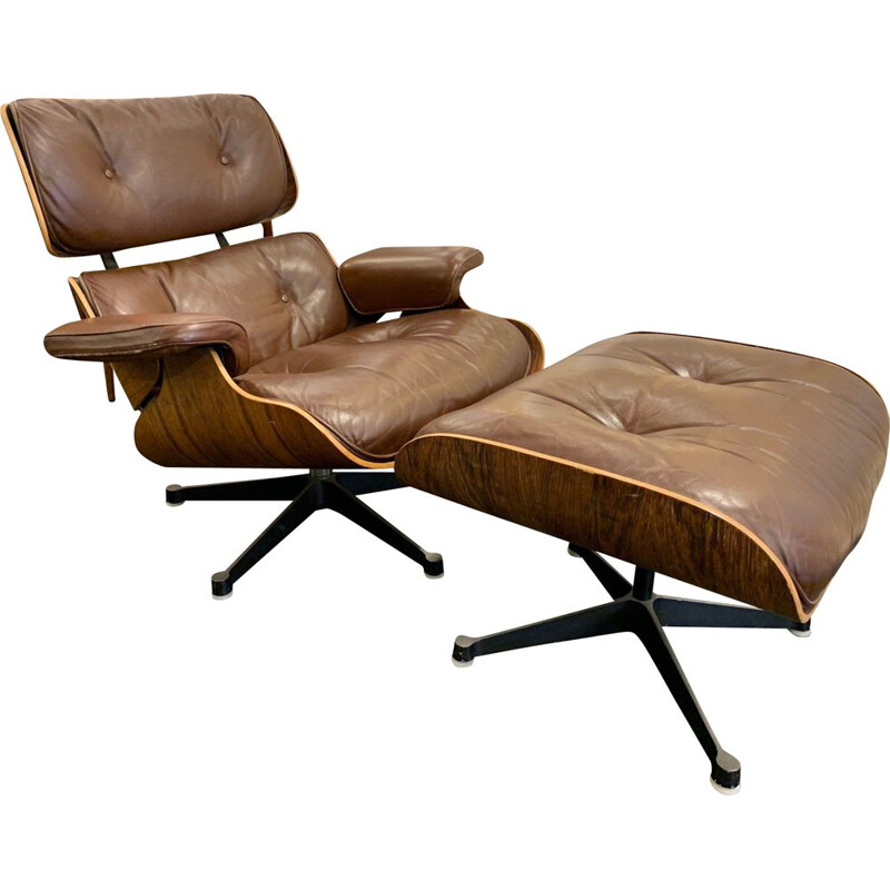 Brown leather lounge chair and Ottoman by Charles and Ray Eames