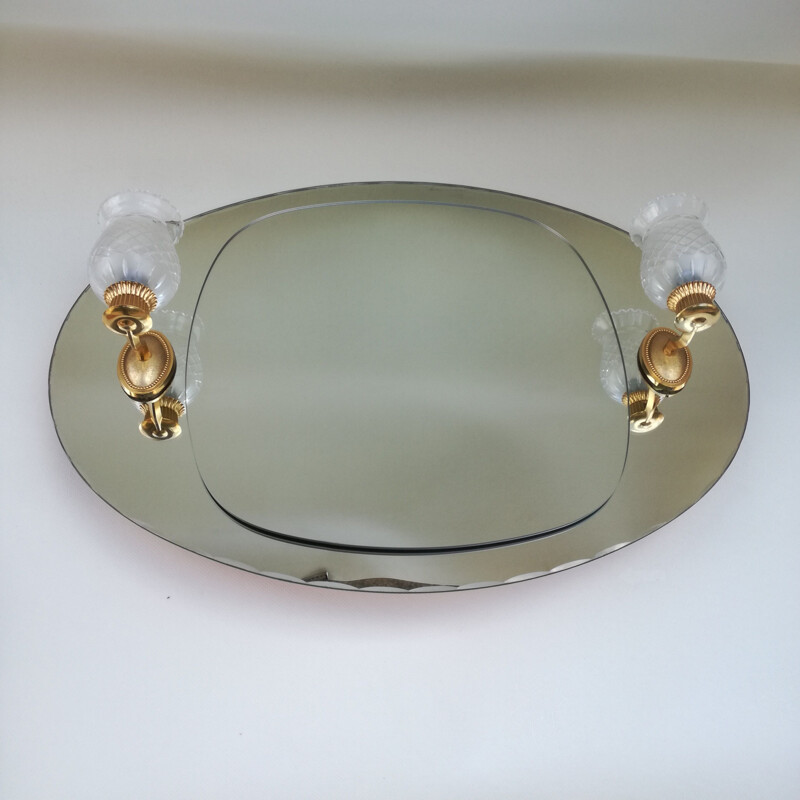 Vintage oval and luminous mirror 