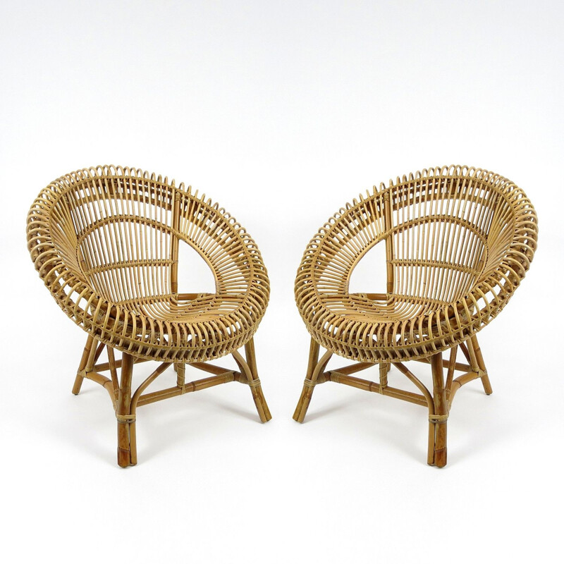 Pair of rattan lounge chairs mid century